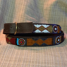 Load image into Gallery viewer, The Savanna Beaded Dog Collar by Her Best Foot Forward is a handmade Maasai ethical pet accessory from East Africa, detailed with vibrant beadwork in white, orange, red, blue, yellow, and brown on leather.