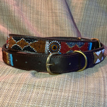 Load image into Gallery viewer, The Savanna Beaded Dog Collar by Her Best Foot Forward features handmade Maasai beadwork in geometric and circular patterns, creating an ethical pet accessory from East Africa, shown on a textured beige fabric background.