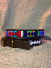 Load image into Gallery viewer, The All the Way Up Beaded Dog Collar by Her Best Foot Forward is a bold, handmade Maasai pet accessory from East Africa, featuring colorful geometric beadwork and shown on a textured beige fabric background.