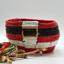 Load image into Gallery viewer, The SHANGA 14-Strand Beaded Bracelet by Her Best Foot Forward is a handmade Maasai piece in festive red, black, and white with a Santa belt-inspired design and decorative beaded strings—perfect holiday jewelry.