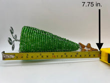 Load image into Gallery viewer, A green Hand-Beaded Christmas Tree by Her Best Foot Forward, made from reclaimed wire by Tanzanian artisans, measures 7.75 inches long and is shown against a plain white background.