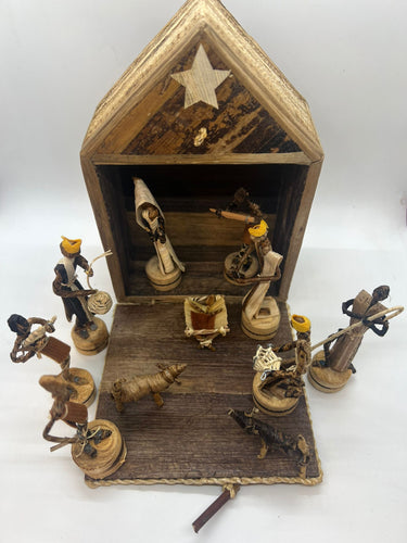 The Her Best Foot Forward Handmade Nativity Set is a fair wage Christmas decor from Tanzania, crafted from straw and wood, with Mary, Joseph, baby Jesus in a manger, Wise Men, shepherds, animals, and rustic stable figurines.
