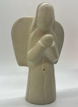 Load image into Gallery viewer, Her Best Foot Forward’s Hand-Carved Soapstone Angels – Divine Decor from East Africa – feature a smooth, cream finish and minimalist lines with outstretched wings cradling a baby, making them elegant pieces for Christmas home decor.