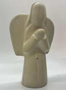 Her Best Foot Forward’s Hand-Carved Soapstone Angels – Divine Decor from East Africa – feature a smooth, cream finish and minimalist lines with outstretched wings cradling a baby, making them elegant pieces for Christmas home decor.