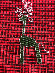 The Reindeer Friends ornament by Her Best Foot Forward is a handcrafted holiday decoration from Tanzania, featuring beads and unique detailing—a perfect addition to your collection of African-inspired festive decor.