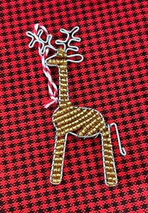 Reindeer Friends by Her Best Foot Forward are handcrafted beaded holiday ornaments from Tanzania, featuring wire and gold beads with a candy cane loop for hanging—perfect for African-inspired holiday decor.