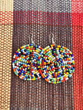 Load image into Gallery viewer, The Duara Circular Beaded Earrings by Her Best Foot Forward are handmade Maasai statement jewelry from East Africa, featuring colorful concentric beads—perfect as standout African accessories.